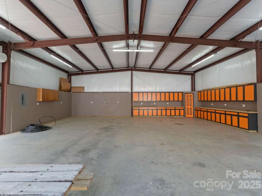 10200 Amsterdam Drive, Mount Pleasant, NC 28124.  MLS# CAR4213612, YatesRealty ID 31037. Can fit several vehicles- previously used to hold large, motorized equipment for homesteading the property