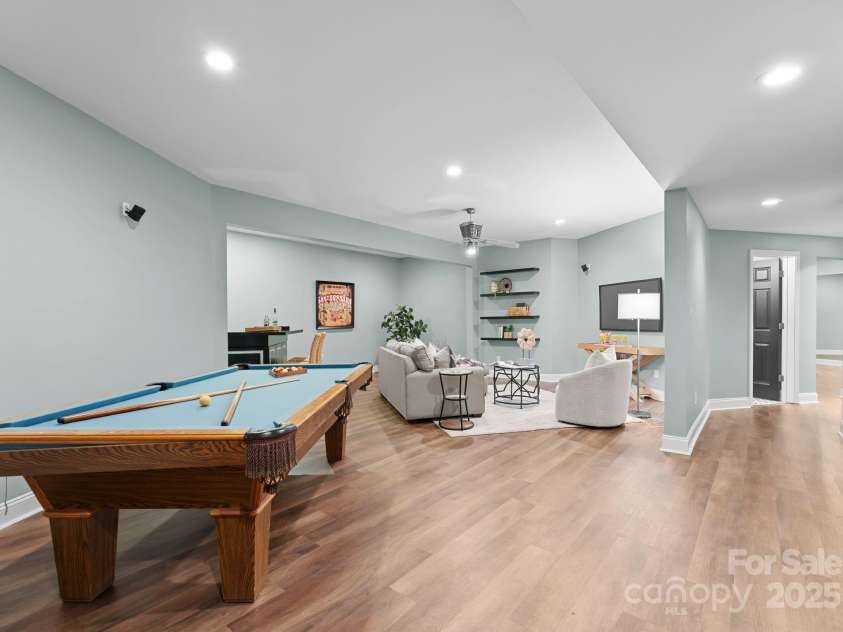 10200 Amsterdam Drive, Mount Pleasant, NC 28124.  MLS# CAR4213612, YatesRealty ID 31037. Entertainment area in the fully finished basement.  Pool table conveys with the property!