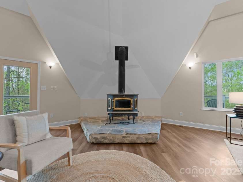 10200 Amsterdam Drive, Mount Pleasant, NC 28124.  MLS# CAR4213612, YatesRealty ID 31037. Wood burining fireplace- added intentional for a sense of character and personality. 