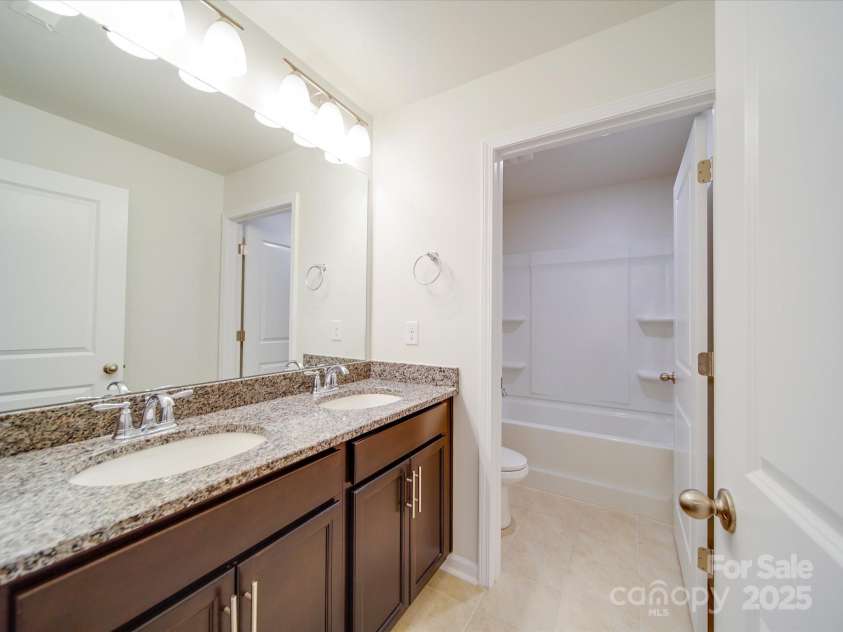 3022 Burnello Court, Iron Station, NC 28080.  MLS# CAR4256845, YatesRealty ID 31040. Hall Bathroom