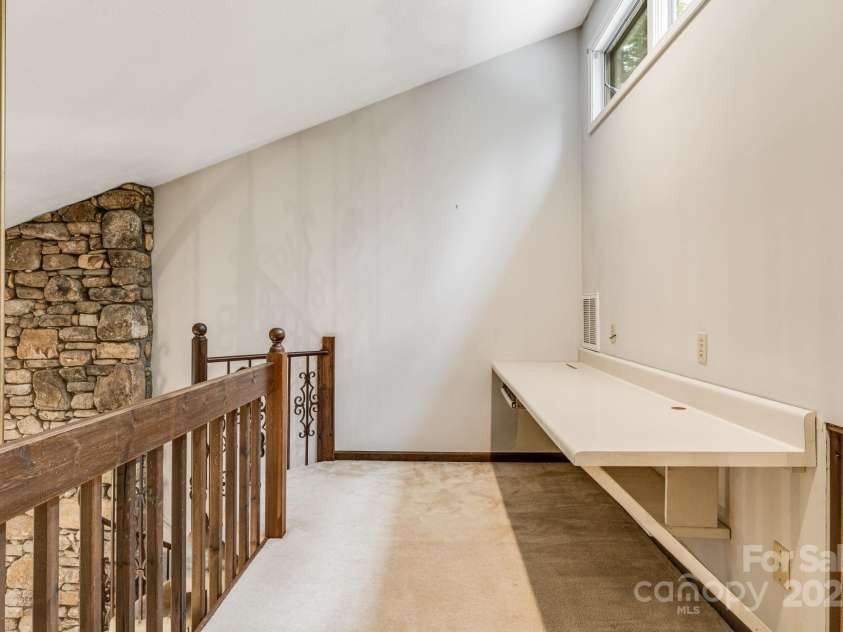 24 Penne Way, Flat Rock, NC 28731.  MLS# CAR4269112, YatesRealty ID 31045. Flexible loft space can be used for an office, studio, or home gym