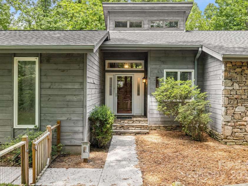 24 Penne Way, Flat Rock, NC 28731.  MLS# CAR4269112, YatesRealty ID 31045. Updated front entry provides plenty of curb appeal
