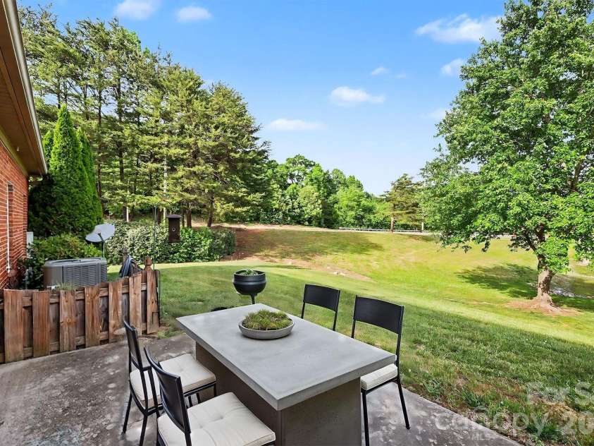 411 Northbridge Drive, High Point, NC 27265.  MLS# CAR4383000, YatesRealty ID 31051. Back patio virtually staged