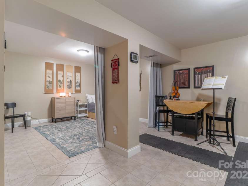 142 Ridge Brook Drive, Weaverville, NC 28787.  MLS# CAR4280040, YatesRealty ID 31054. Finished Basement