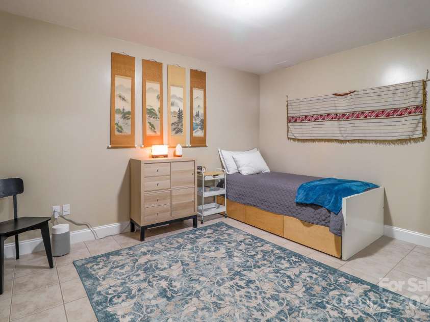 142 Ridge Brook Drive, Weaverville, NC 28787.  MLS# CAR4280040, YatesRealty ID 31054. Finished Basement