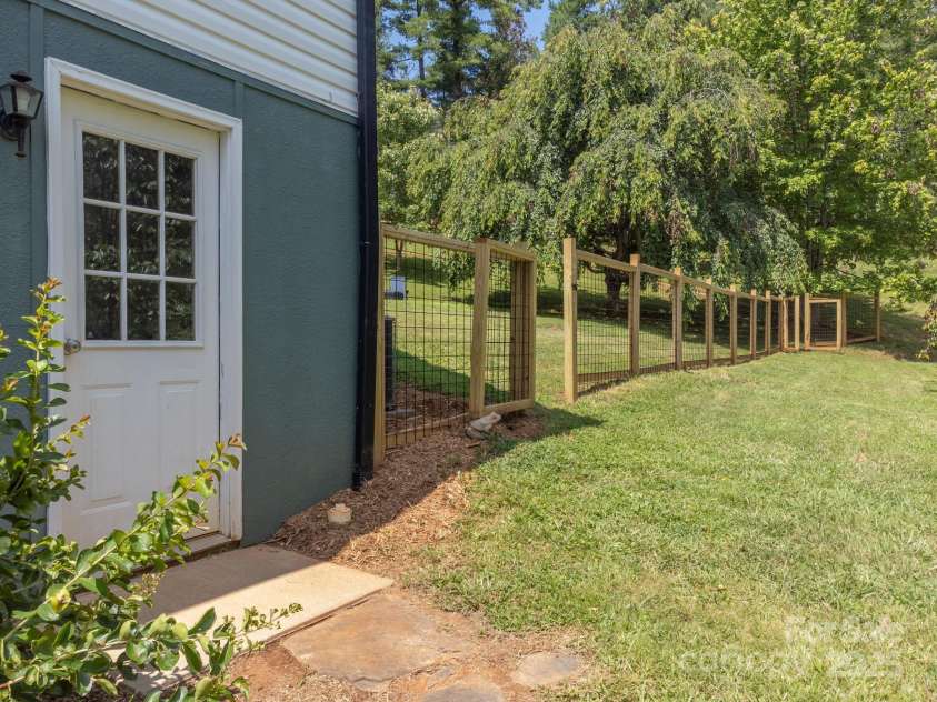 142 Ridge Brook Drive, Weaverville, NC 28787.  MLS# CAR4280040, YatesRealty ID 31054. Garage Entrance