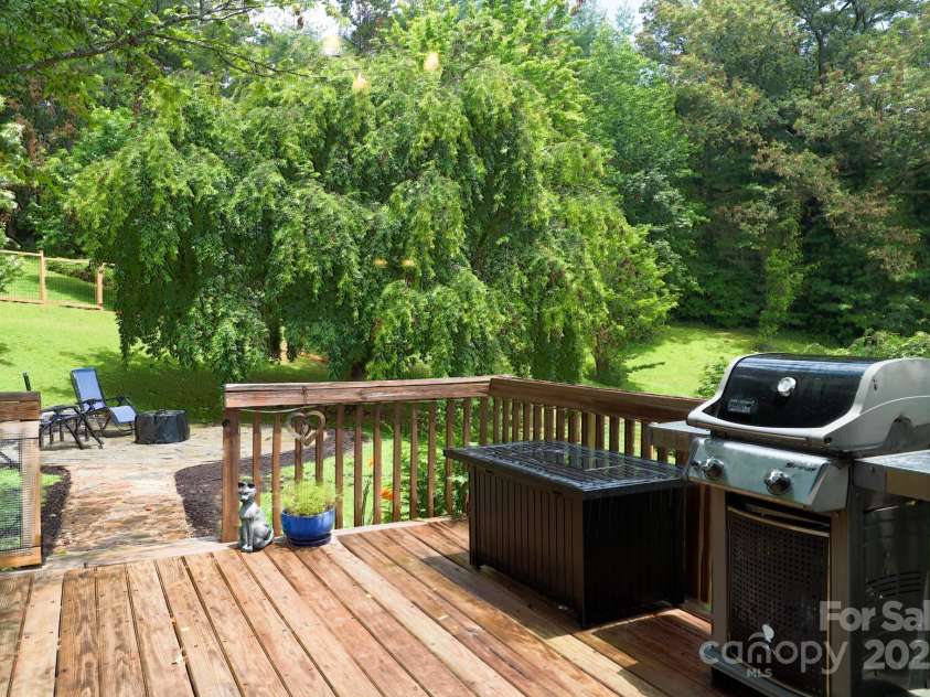 142 Ridge Brook Drive, Weaverville, NC 28787.  MLS# CAR4332710, YatesRealty ID 31054. Deck to Patio and Firepit