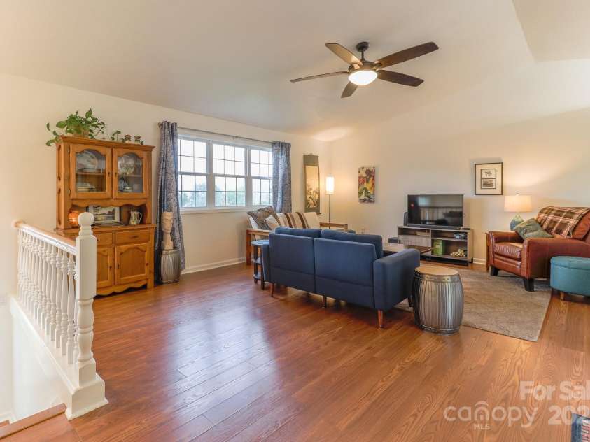 142 Ridge Brook Drive, Weaverville, NC 28787.  MLS# CAR4332710, YatesRealty ID 31054. Living to Stairs