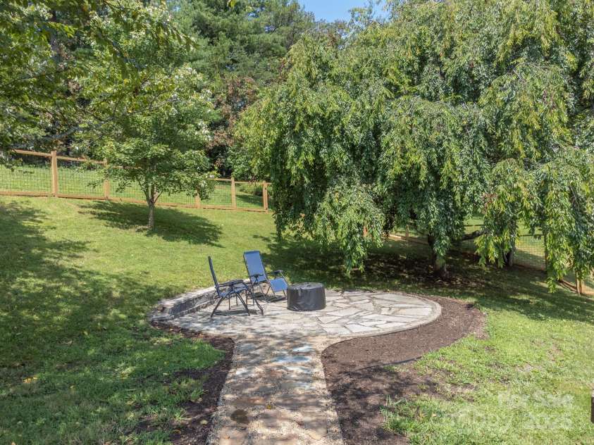 142 Ridge Brook Drive, Weaverville, NC 28787.  MLS# CAR4332710, YatesRealty ID 31054. Patio and Firepit