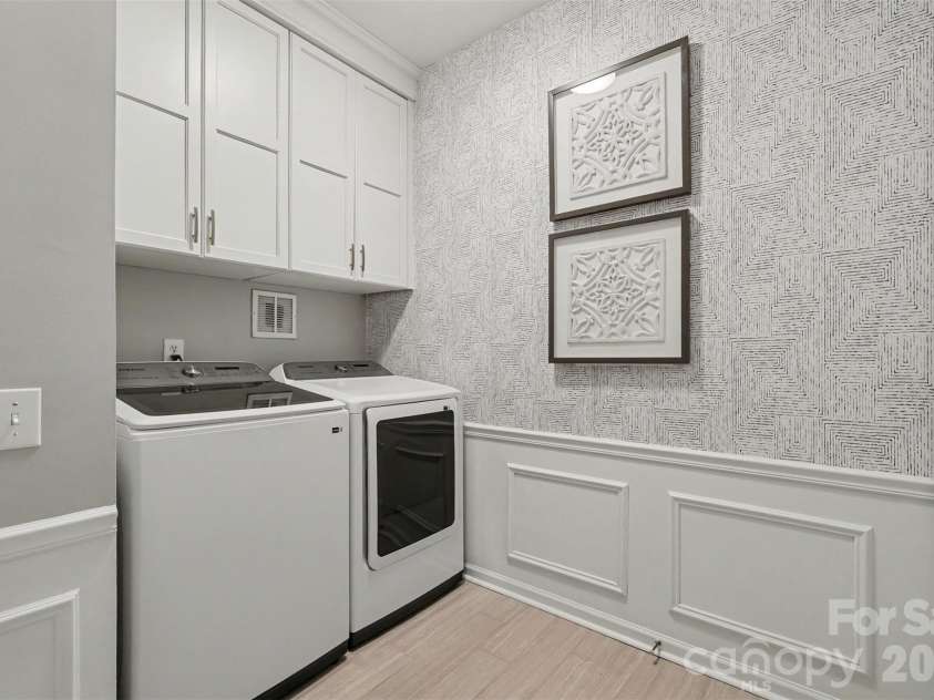 2517 Coltsgate Road, Waxhaw, NC 28173.  MLS# CAR4415991, YatesRealty ID 31055. Updated Laundry on Main level with built in cabinets.