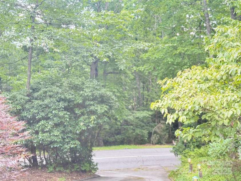 877 Soquili Drive, Brevard, NC 28712.  MLS# CAR4282524, YatesRealty ID 31057. Enjoy your winter lake views.