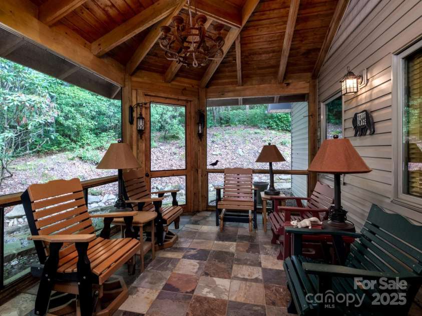 877 Soquili Drive, Brevard, NC 28712.  MLS# CAR4282524, YatesRealty ID 31057. Second screened in porch, totally private.