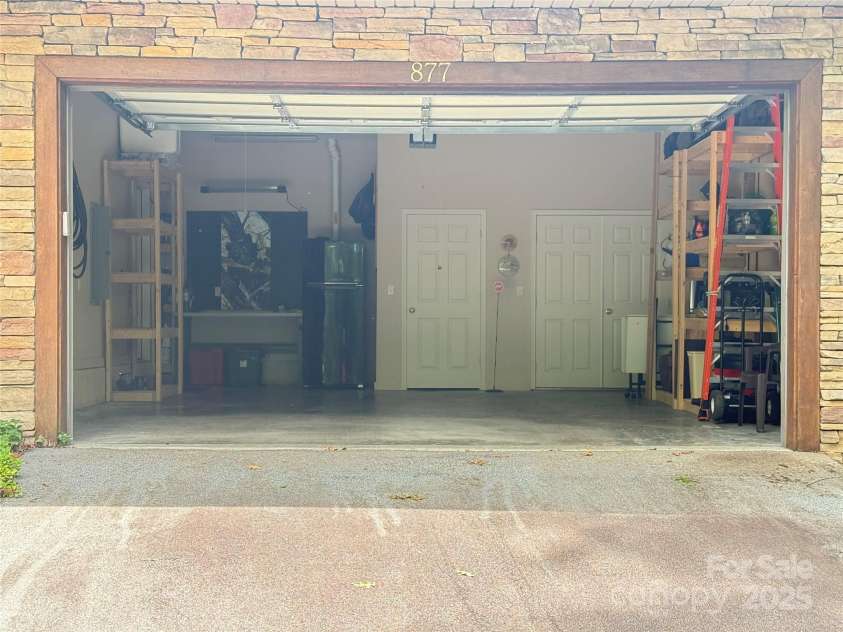 877 Soquili Drive, Brevard, NC 28712.  MLS# CAR4282524, YatesRealty ID 31057. The garage is immaculate.