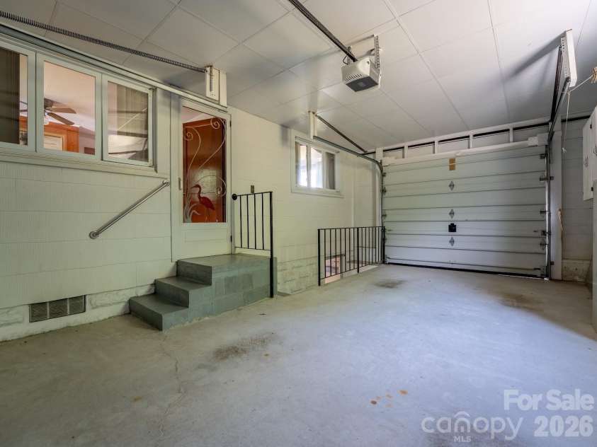 1230 Dana Road, Hendersonville, NC 28792.  MLS# CAR4392135, YatesRealty ID 31064. Attached one car garage interior
