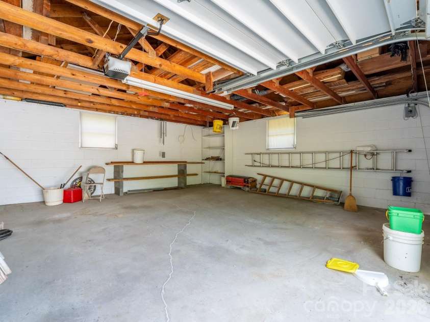 1230 Dana Road, Hendersonville, NC 28792.  MLS# CAR4392135, YatesRealty ID 31064. Detached two car garage interior