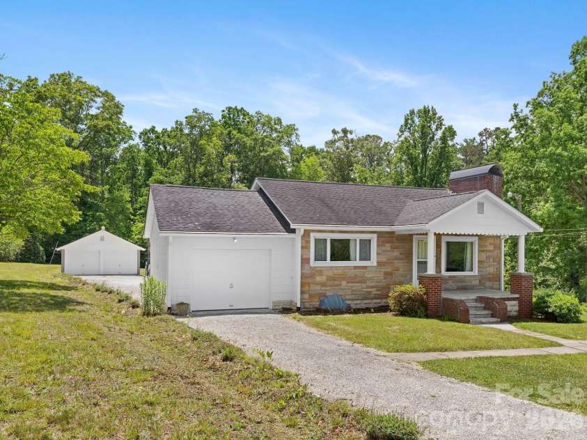 1230 Dana Road, Hendersonville, NC 28792.  MLS# CAR4392135, YatesRealty ID 31064. Front View showing detached garage behind