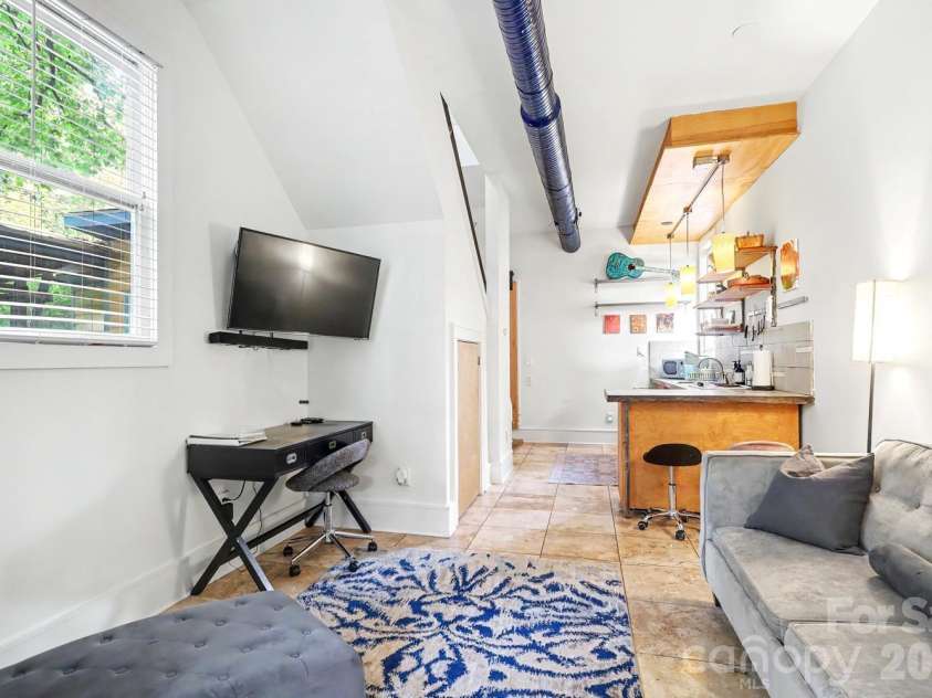 904 36th Street, Charlotte, NC 28205.  MLS# CAR4392678, YatesRealty ID 31067. Guest house living to kitchen