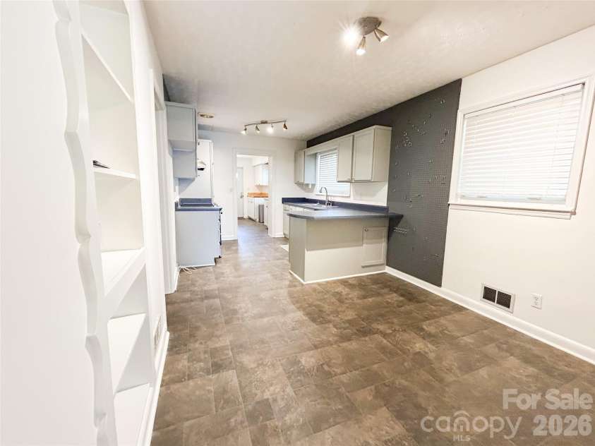 119 Hillcrest Street, Shelby, NC 28152.  MLS# CAR4391775, YatesRealty ID 31068. Dining room view of kitchen