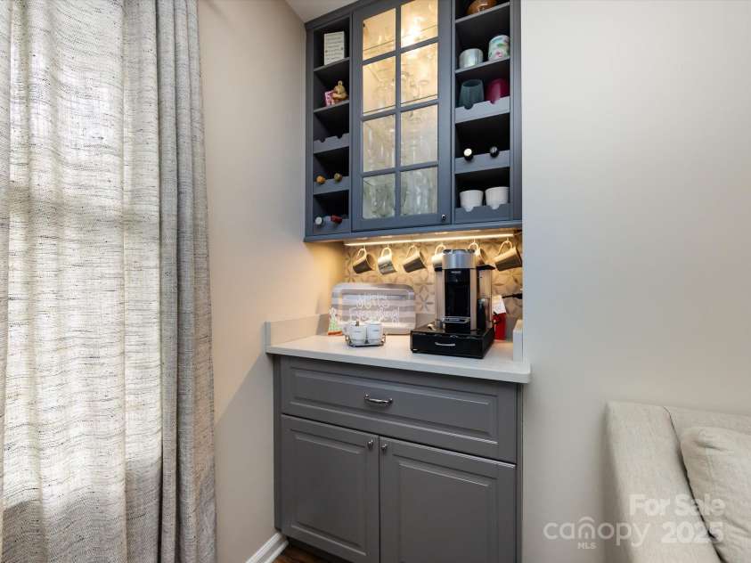 3508 Colony Crossing Drive, Charlotte, NC 28226.  MLS# CAR4279555, YatesRealty ID 31072. Custom coffee/wine bar with cabinetry and under cabinet lighting