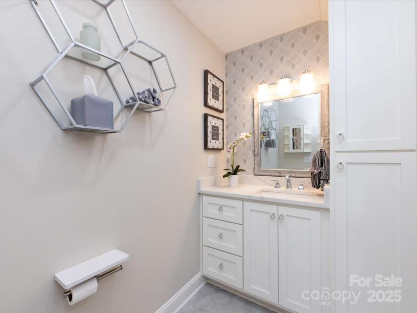 3508 Colony Crossing Drive, Charlotte, NC 28226.  MLS# CAR4279555, YatesRealty ID 31072. Custom vanity with linen storage (there is a linen closet in the hall too!)
