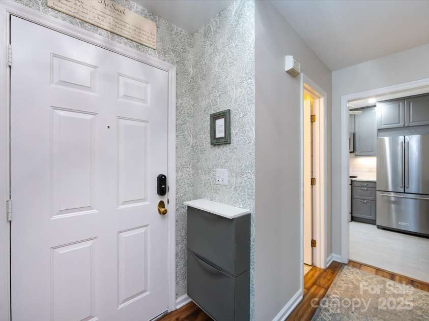 3508 Colony Crossing Drive, Charlotte, NC 28226.  MLS# CAR4279555, YatesRealty ID 31072. Entry foyer features storage and designer lighting