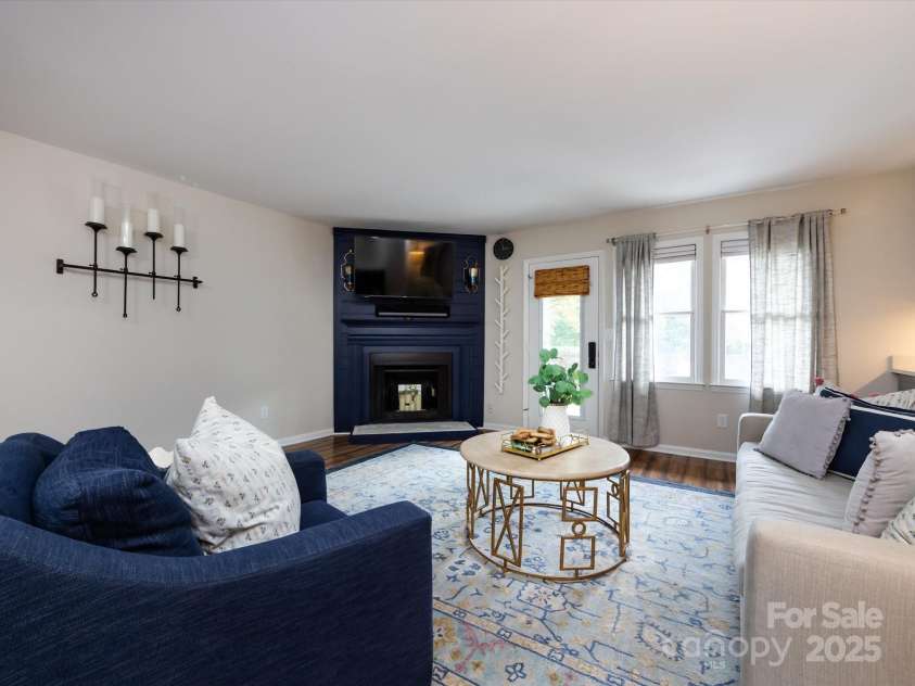 3508 Colony Crossing Drive, Charlotte, NC 28226.  MLS# CAR4279555, YatesRealty ID 31072. Large living room with great light and centerpiece fireplace