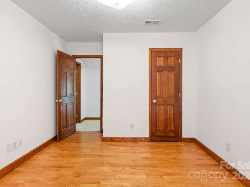 15 Elmwood Lane, Asheville, NC 28803.  MLS# CAR4231161, YatesRealty ID 31074. Bonus room upstairs has closet, but no window