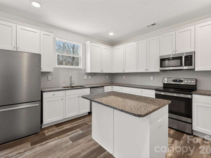 7308 Rothmore Street, Charlotte, NC 28215.  MLS# CAR4340834, YatesRealty ID 31075. Large island and prep space 