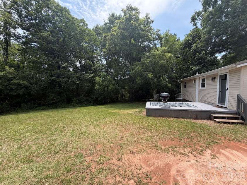 68 Doc Stokes Drive, Taylorsville, NC 28681.  MLS# CAR4393235, YatesRealty ID 31082. Exterior view, back yard