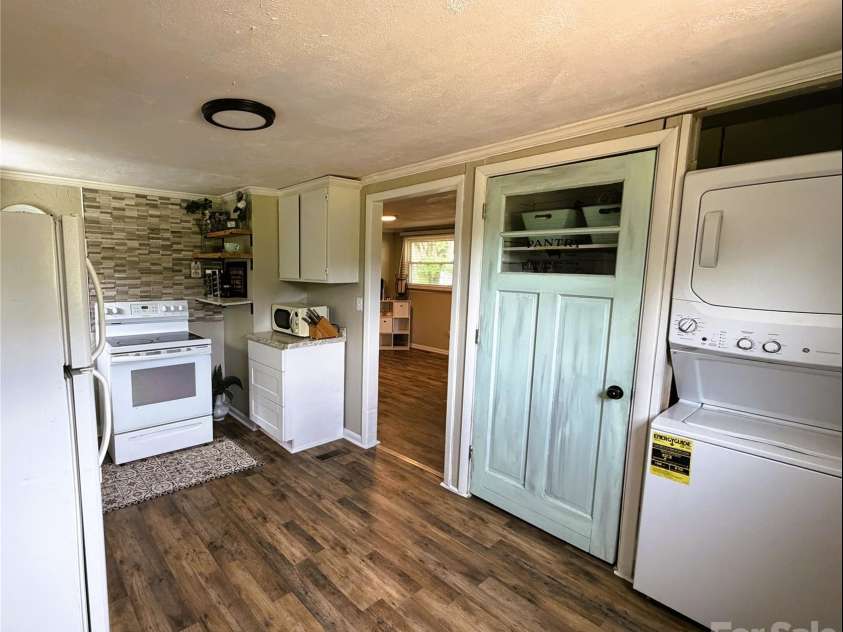 68 Doc Stokes Drive, Taylorsville, NC 28681.  MLS# CAR4393235, YatesRealty ID 31082. Kitchen (pantry and laundry closet)