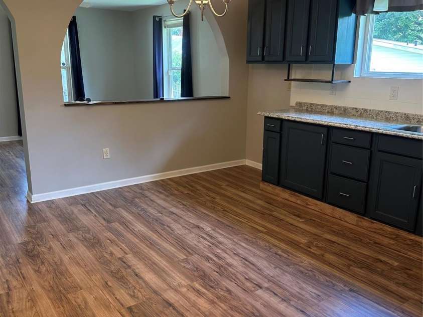 1208 North Davis Avenue, Newton, NC 28658.  MLS# CAR4283264, YatesRealty ID 31083. Kitchen and open wall to living room