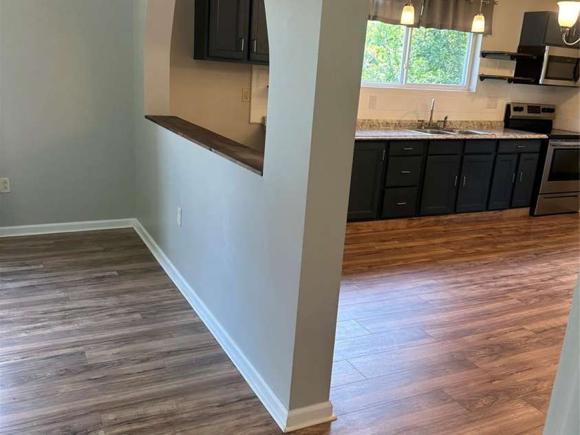 1208 North Davis Avenue, Newton, NC 28658.  MLS# CAR4283264, YatesRealty ID 31083. Open wall between Living room and kitchen