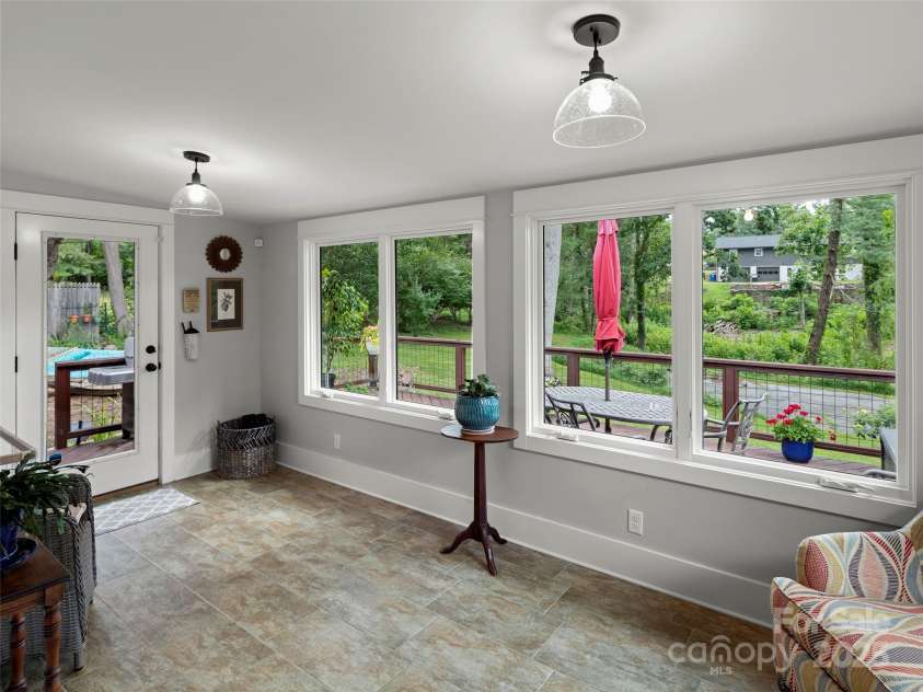 19 Pheasant Drive, Asheville, NC 28803.  MLS# CAR4284659, YatesRealty ID 31086. Sunroom off the Kitchen
