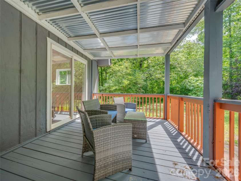 3276 Howard Gap Road, Hendersonville, NC 28792.  MLS# CAR4393443, YatesRealty ID 31087. Covered deck space