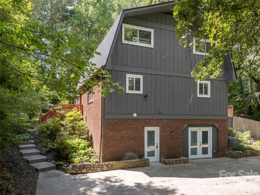 3276 Howard Gap Road, Hendersonville, NC 28792.  MLS# CAR4393443, YatesRealty ID 31087. Entry from parking to lower level.