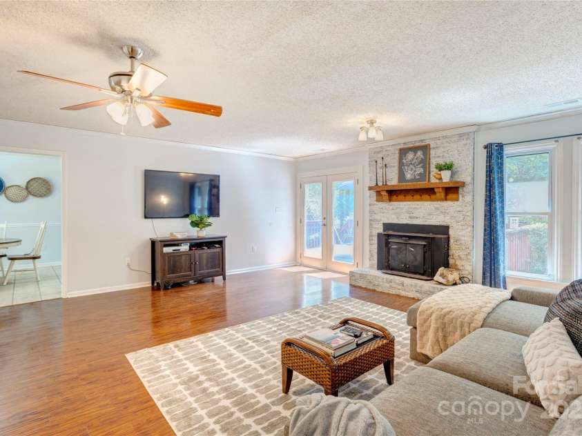 8913 Gosnell Drive, Charlotte, NC 28227.  MLS# CAR4289170, YatesRealty ID 31091. Back deck off living room. Kitchen off living room. 