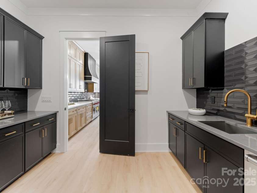 2007 Kendall Drive, Wesley Chapel, NC 28173.  MLS# CAR4207149, YatesRealty ID 31097. Scullery w/Bev Fridge, Sink & Dishwasher