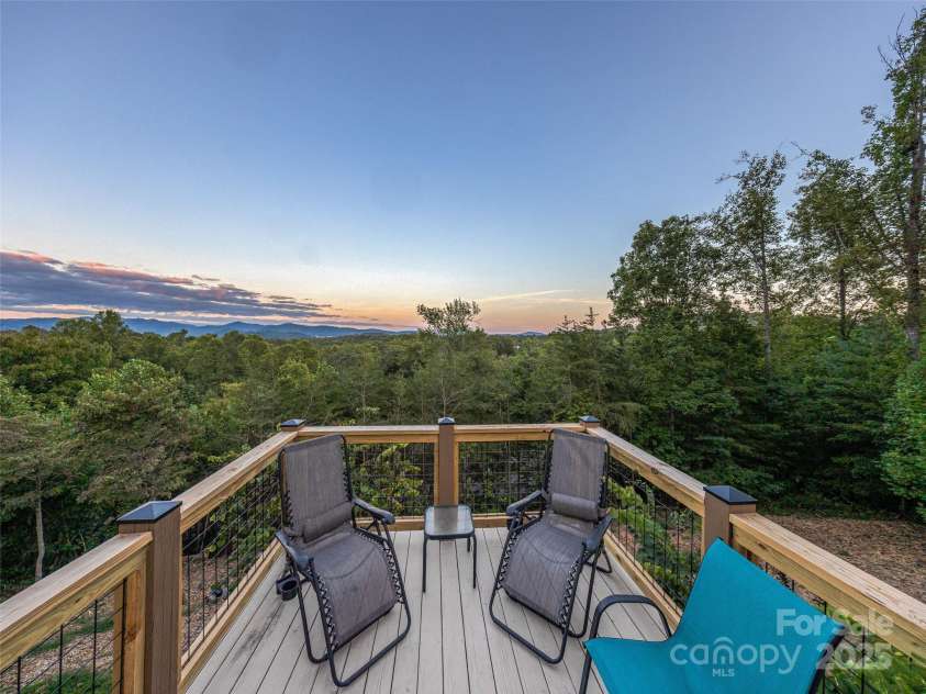 18 Timber Moss Drive, Asheville, NC 28804.  MLS# CAR4299629, YatesRealty ID 31099. Cozy sitting area off main deck