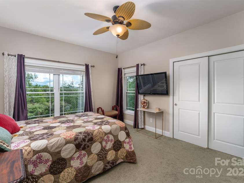 18 Timber Moss Drive, Asheville, NC 28804.  MLS# CAR4299629, YatesRealty ID 31099. Guest bedroom  ensuite #1 with double closets