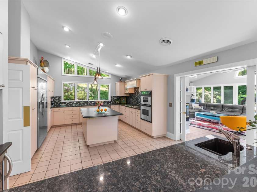 200 Robinhood Road, Asheville, NC 28804.  MLS# CAR4361216, YatesRealty ID 31099. Expansive bar with an additional sink and a  Grohe faucet