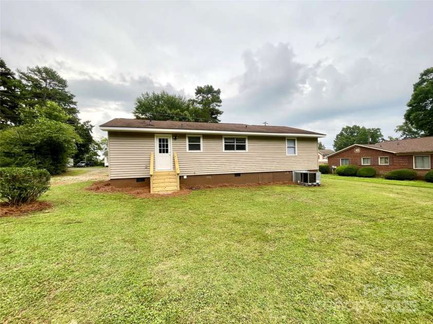 400 Lucy Avenue, Concord, NC 28027.  MLS# CAR4280783, YatesRealty ID 31101. Back of house showing new steps