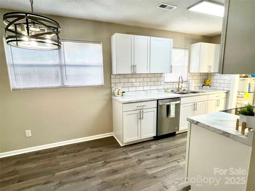 400 Lucy Avenue, Concord, NC 28027.  MLS# CAR4280783, YatesRealty ID 31101. Breakfast area w/modern lighting