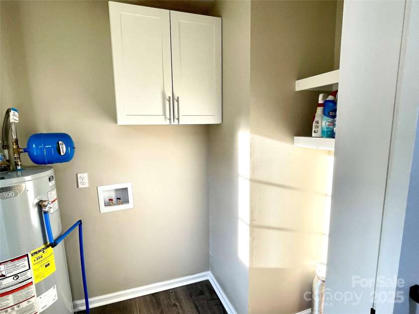 400 Lucy Avenue, Concord, NC 28027.  MLS# CAR4280783, YatesRealty ID 31101. Laundry w/cabinet and shelf