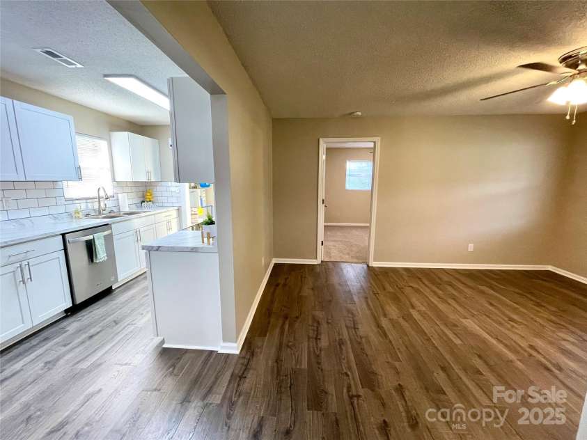 400 Lucy Avenue, Concord, NC 28027.  MLS# CAR4280783, YatesRealty ID 31101. Livingroom looking into kitchen