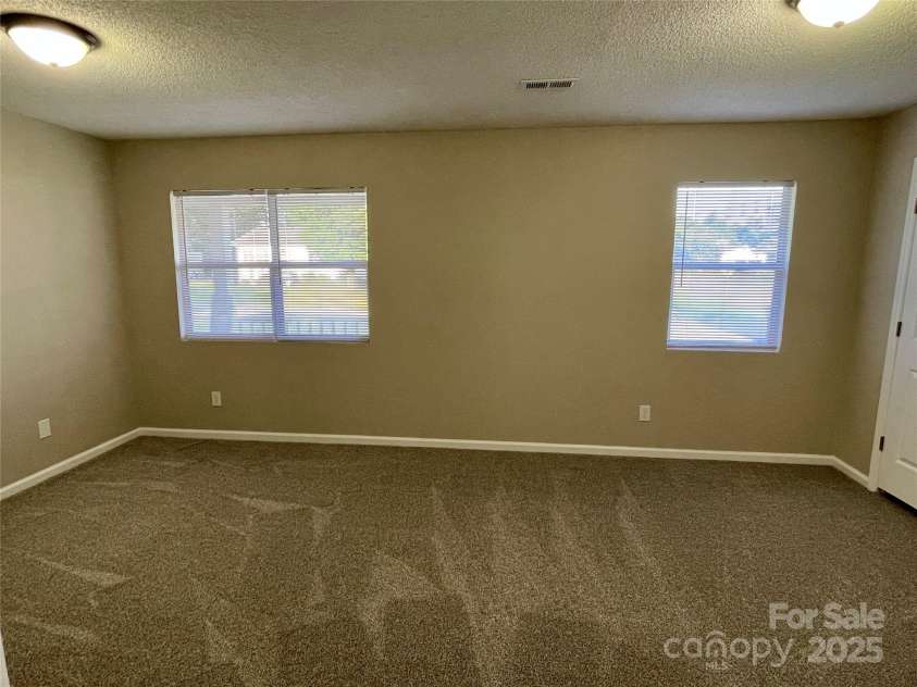 400 Lucy Avenue, Concord, NC 28027.  MLS# CAR4280783, YatesRealty ID 31101. Oversized secondary bedroom