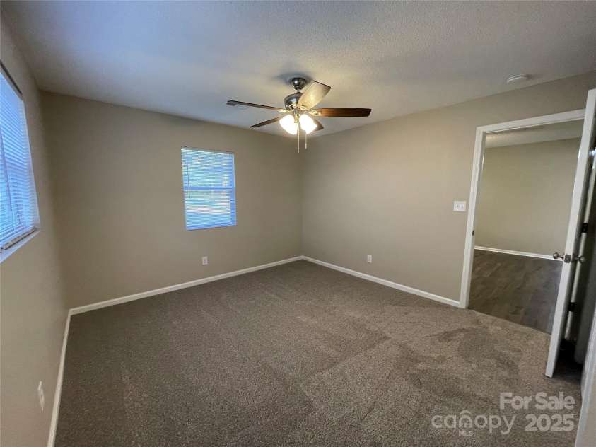 400 Lucy Avenue, Concord, NC 28027.  MLS# CAR4280783, YatesRealty ID 31101. Primary BR from bathroom view