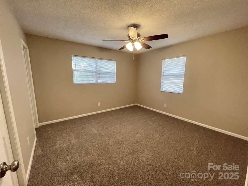 400 Lucy Avenue, Concord, NC 28027.  MLS# CAR4280783, YatesRealty ID 31101. Primary BR w/new carpet & ceiling fan