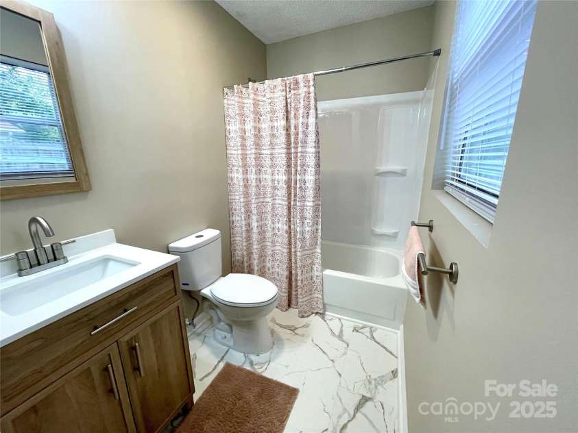 400 Lucy Avenue, Concord, NC 28027.  MLS# CAR4280783, YatesRealty ID 31101. Primary bthr w/new plumbing & vanity