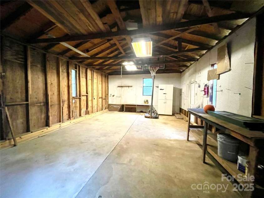 400 Lucy Avenue, Concord, NC 28027.  MLS# CAR4280783, YatesRealty ID 31101. Storage cabinet and table to remain