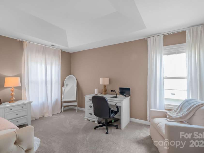 1002 Sudbury Lane, Matthews, NC 28104.  MLS# CAR4285222, YatesRealty ID 31102. Sitting area in primary bedroom